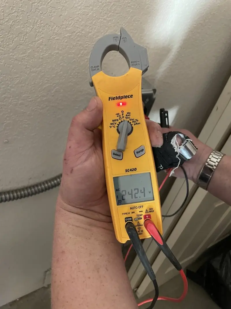 Voltage testing with clamp meter during Generator Installation in Bensville